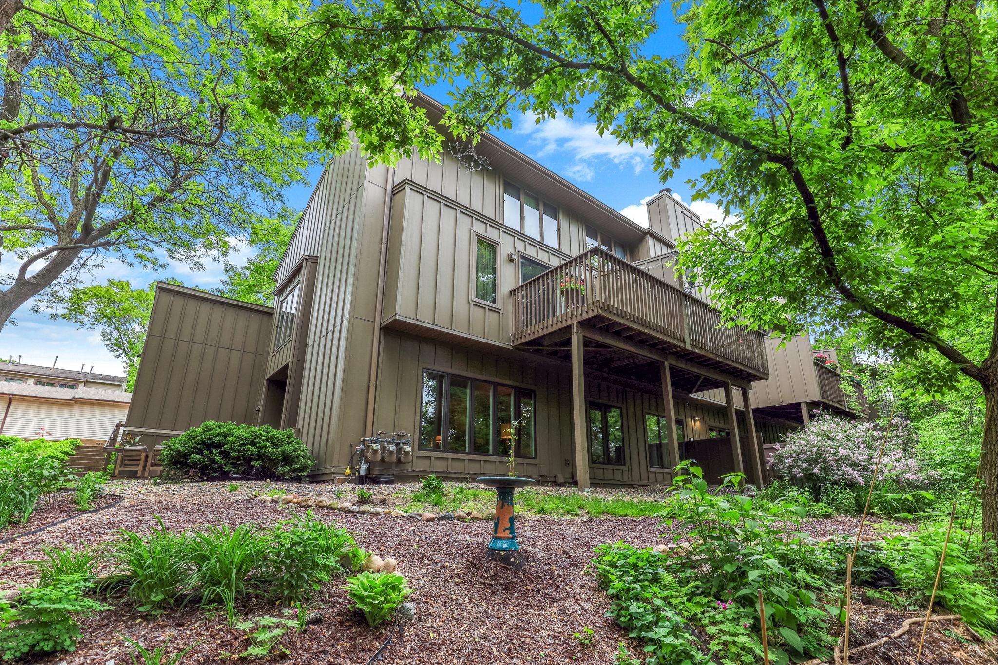 Welcoming front entry, and mature landscaping that adds privacy and curb appeal.