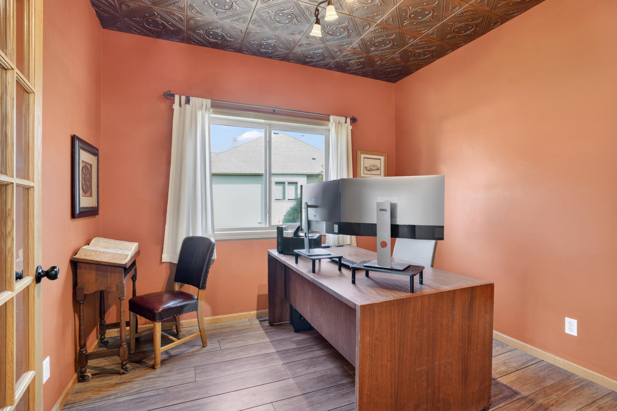 Main-floor office or flex room with French doors and natural light