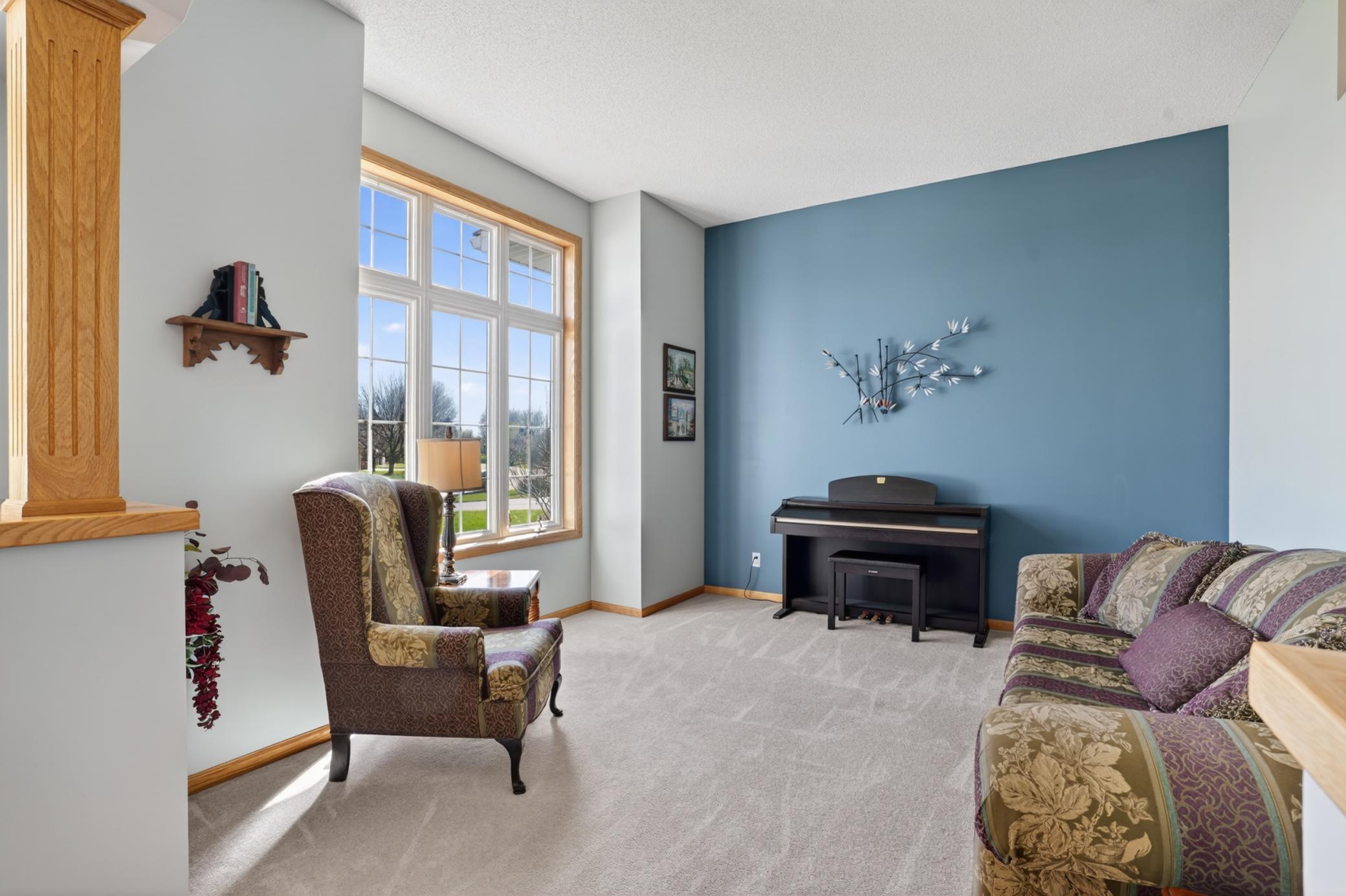 Bright front living room with large windows and natural light