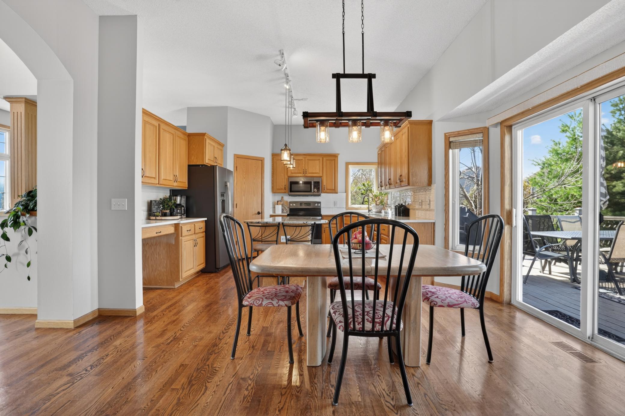 Open dining area connected to kitchen and outdoor entertaining space