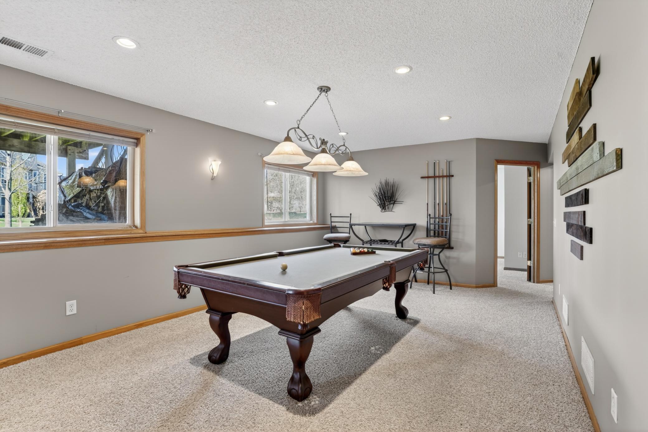 Dedicated billiards and game area offering exceptional lower-level entertainment space