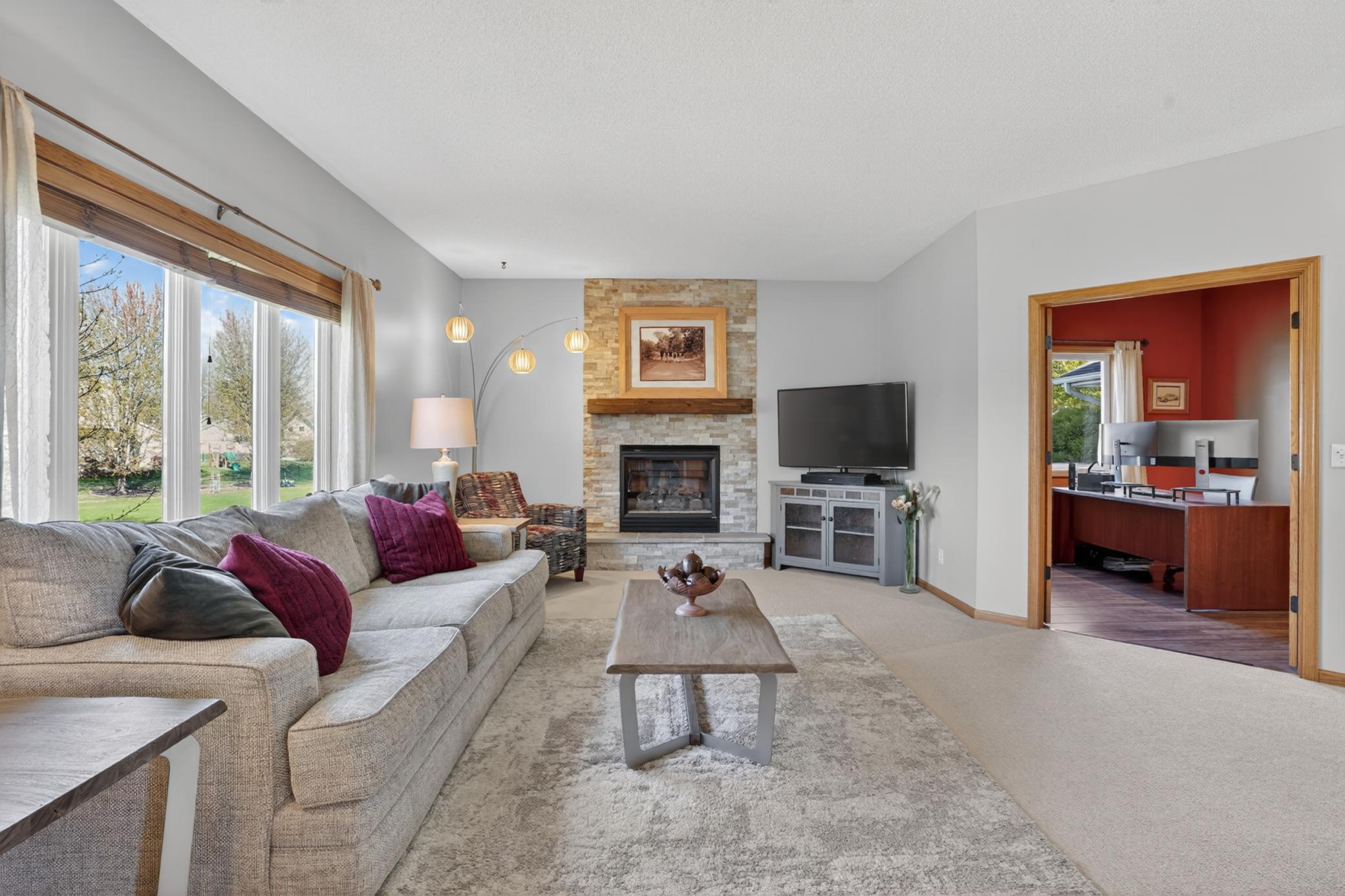 Main-level family room with adjacent office and open flow to kitchen and dining