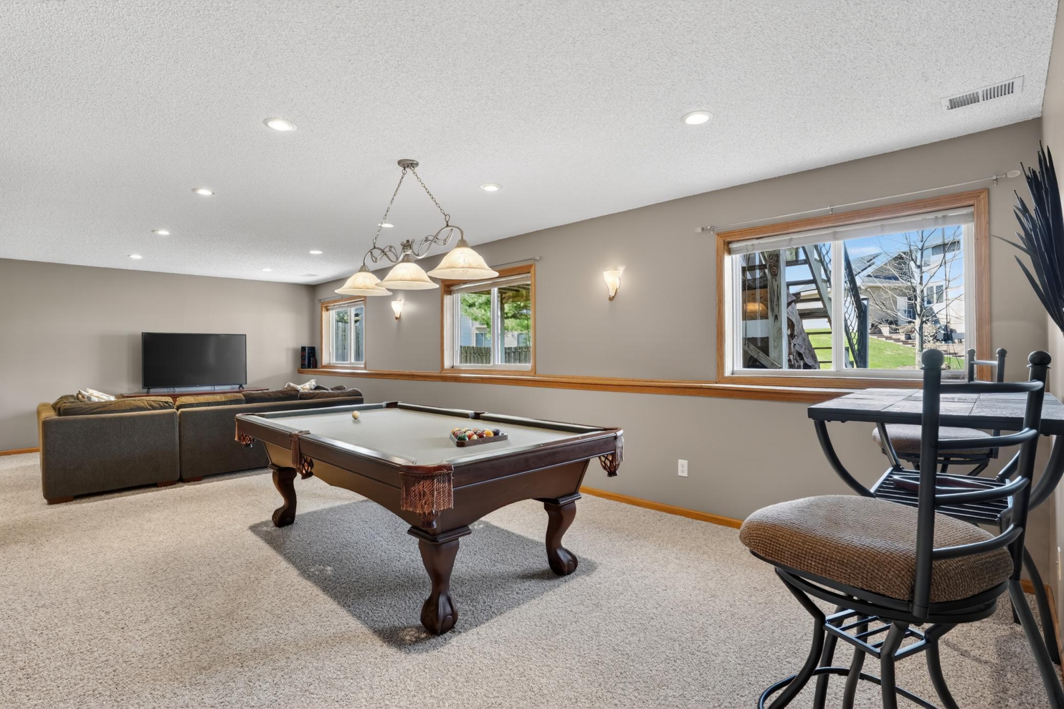 Additional view of the lower-level recreation space with room for gatherings and activities