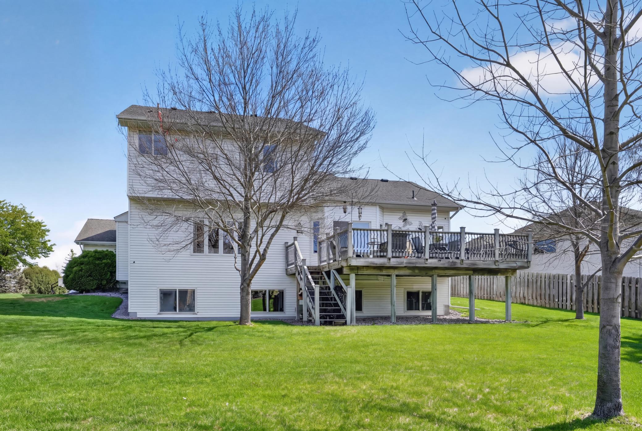 Expansive backyard with mature trees, open lawn, and excellent outdoor enjoyment space