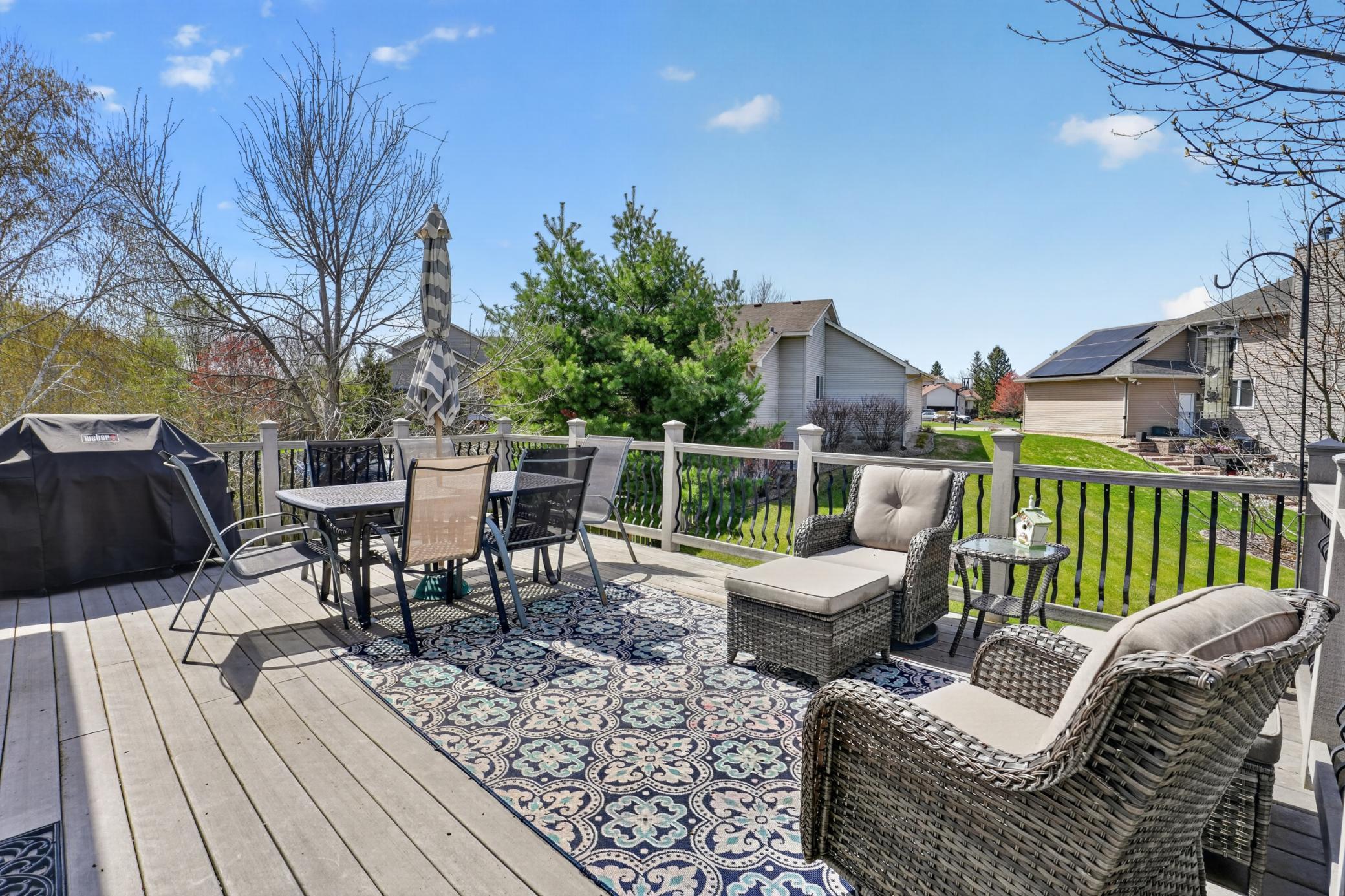 Oversized maintenance-friendly deck with plenty of space for dining, grilling, and relaxing
