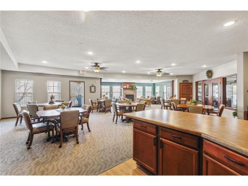 There are so many amenities here! The party/community room pictured here is just one of them. There is a deck outside to enjoy as well. There is also a billiards room, a library and a craft room! So much to do!