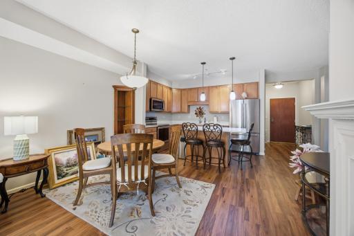 The kitchen flows wonderfully into a dining area. Plenty of room for a table as well as stools around the island. Entertaining here would be fun!