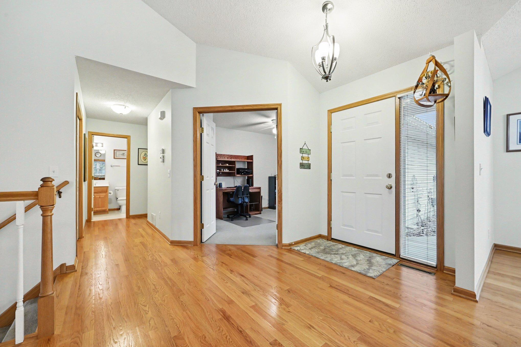 As you enter the home there is a bedroom to the right that is being used as an office., there is bath around the corner and the laundry room.