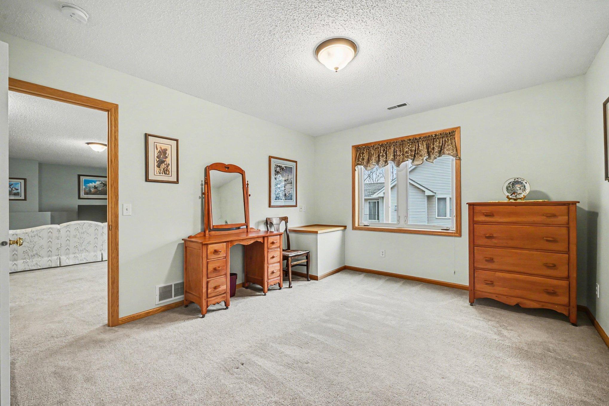 Lower level bedroom adjacent to the amusement room.