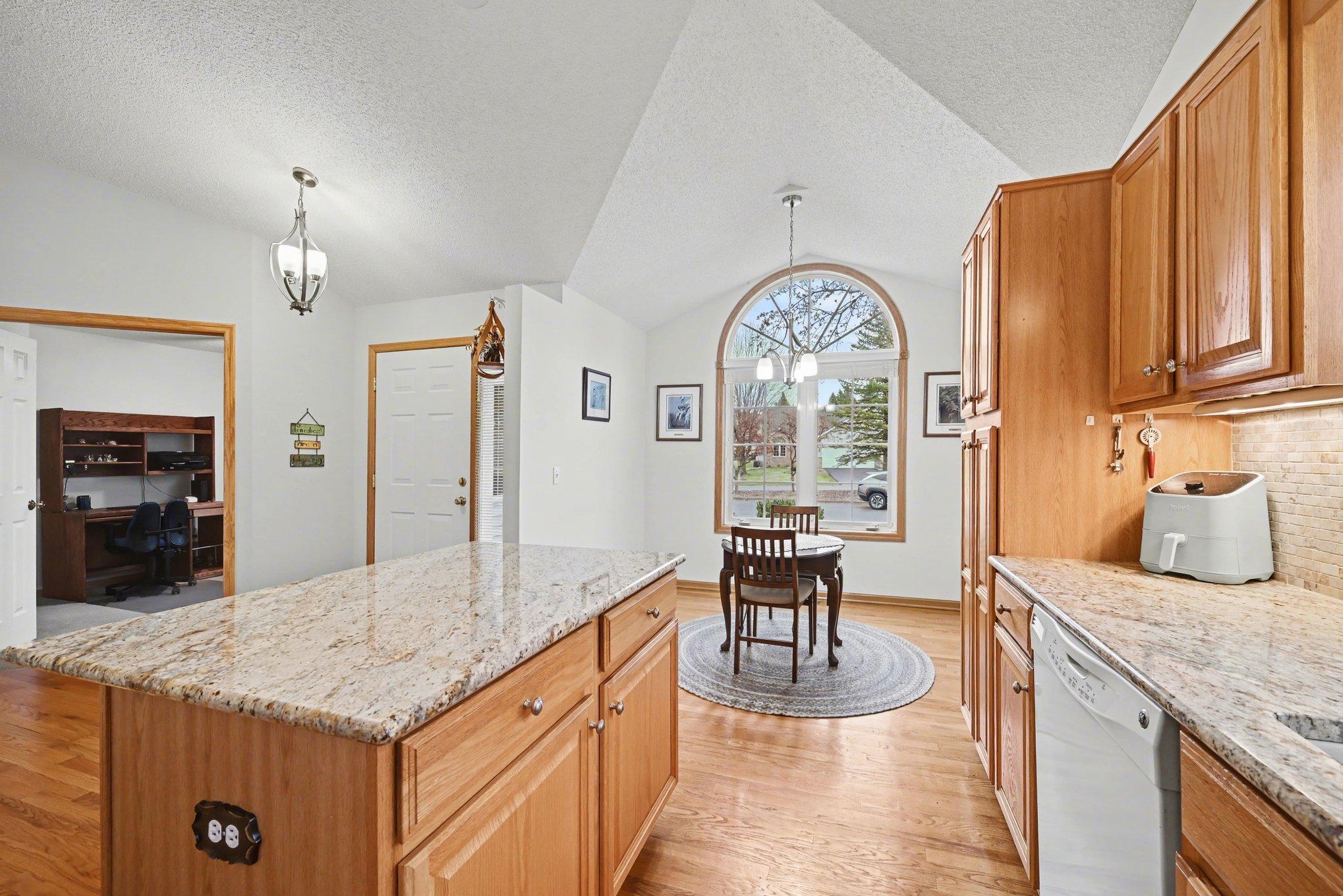 Real hardwood floors and solid raised paneled cupboards, granite countertops.