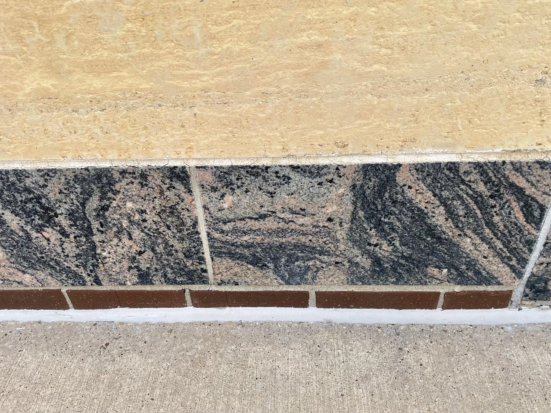 Exterior includes limestone, marble and brick