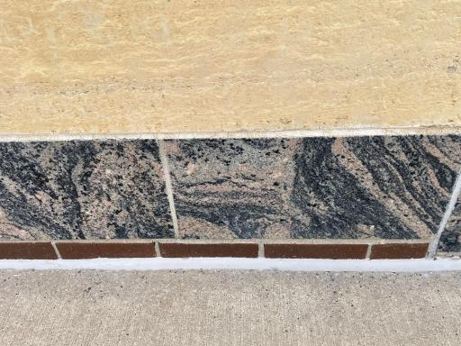 Exterior includes limestone, marble and brick