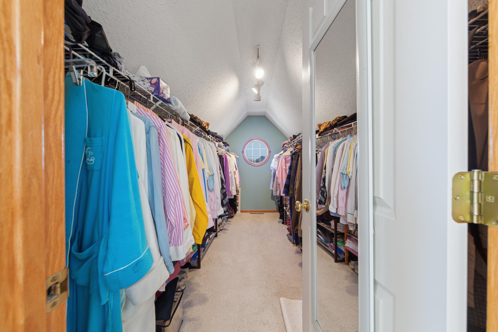 Primary bedroom walk-in closet