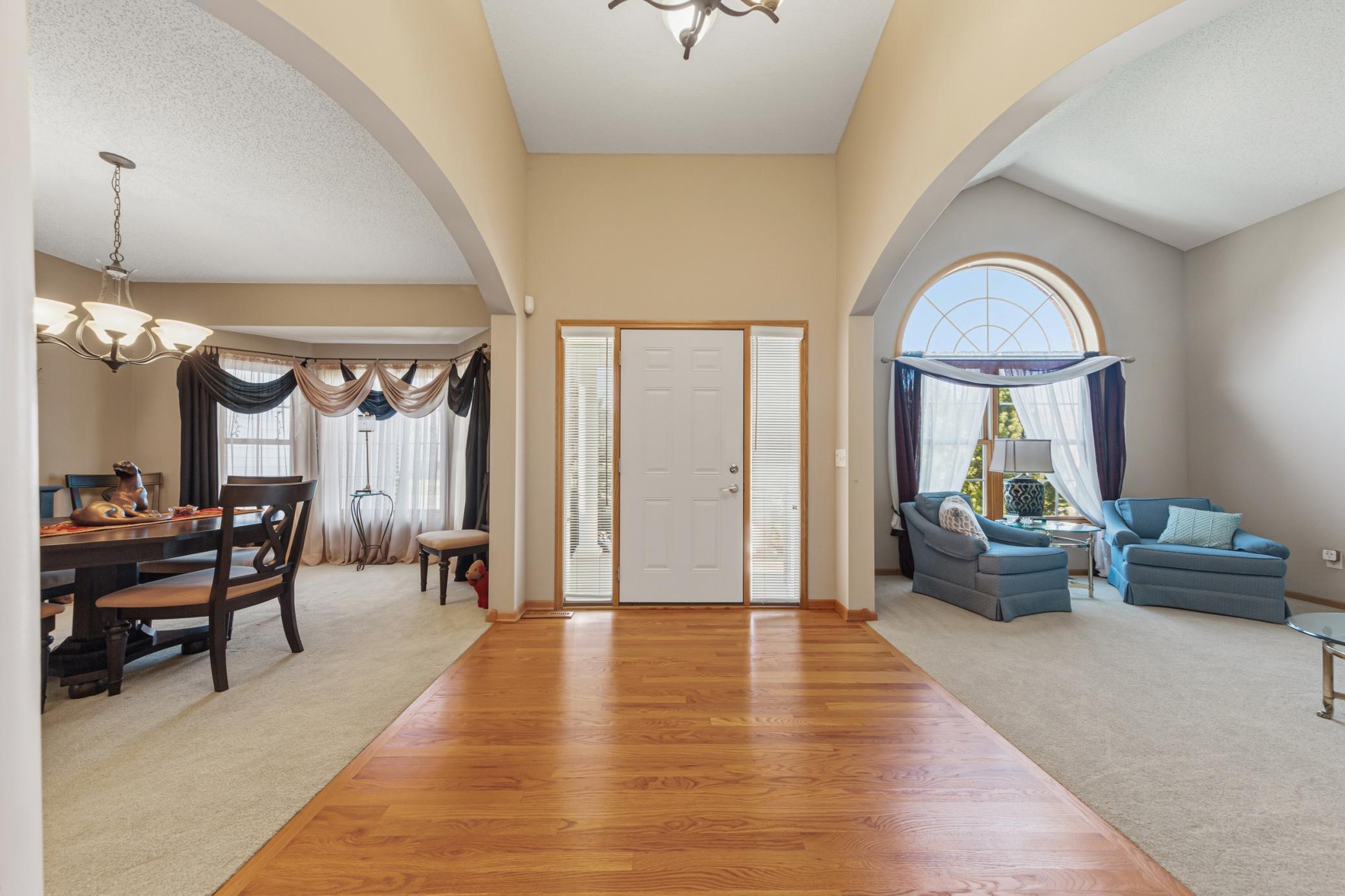 Grand open foyer invites you into this beautiful home