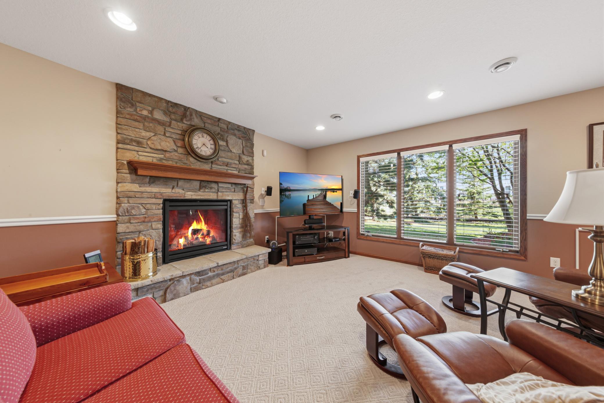 Amusement/Family room lower-level with floor to ceiling windows.