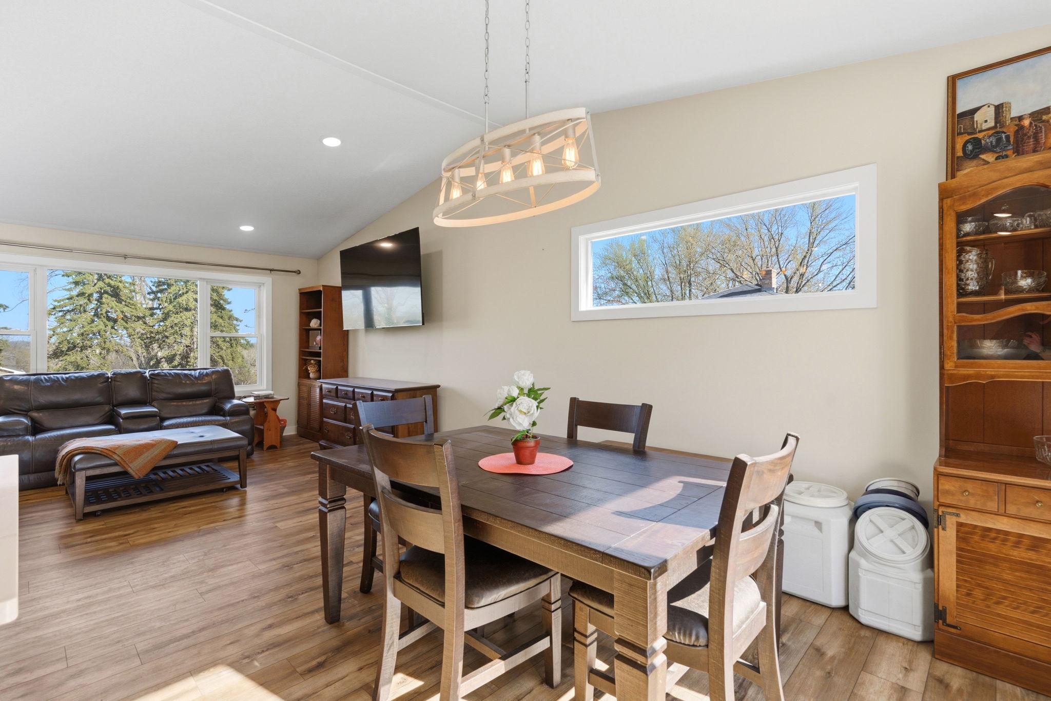 dining room that overlooks a huge backyard patio