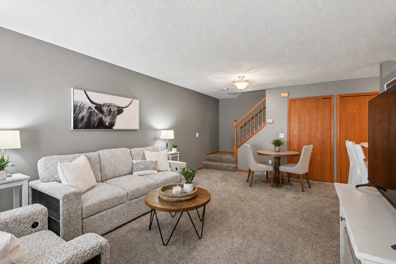 Spacious living room with a cute dining nook plus you have a breakfast bar for extra dining space!