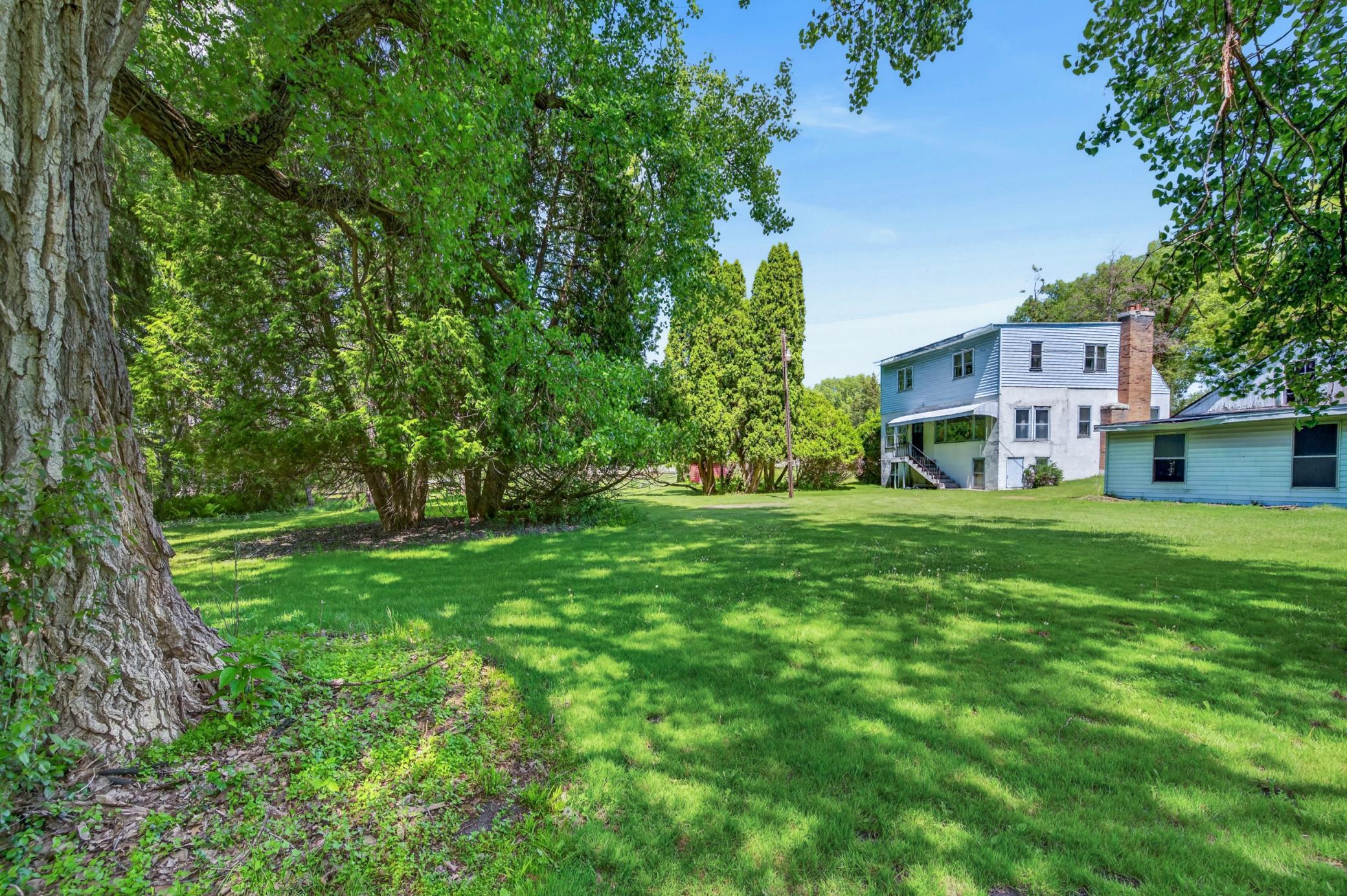Double lot with open yard space & wooded privacy