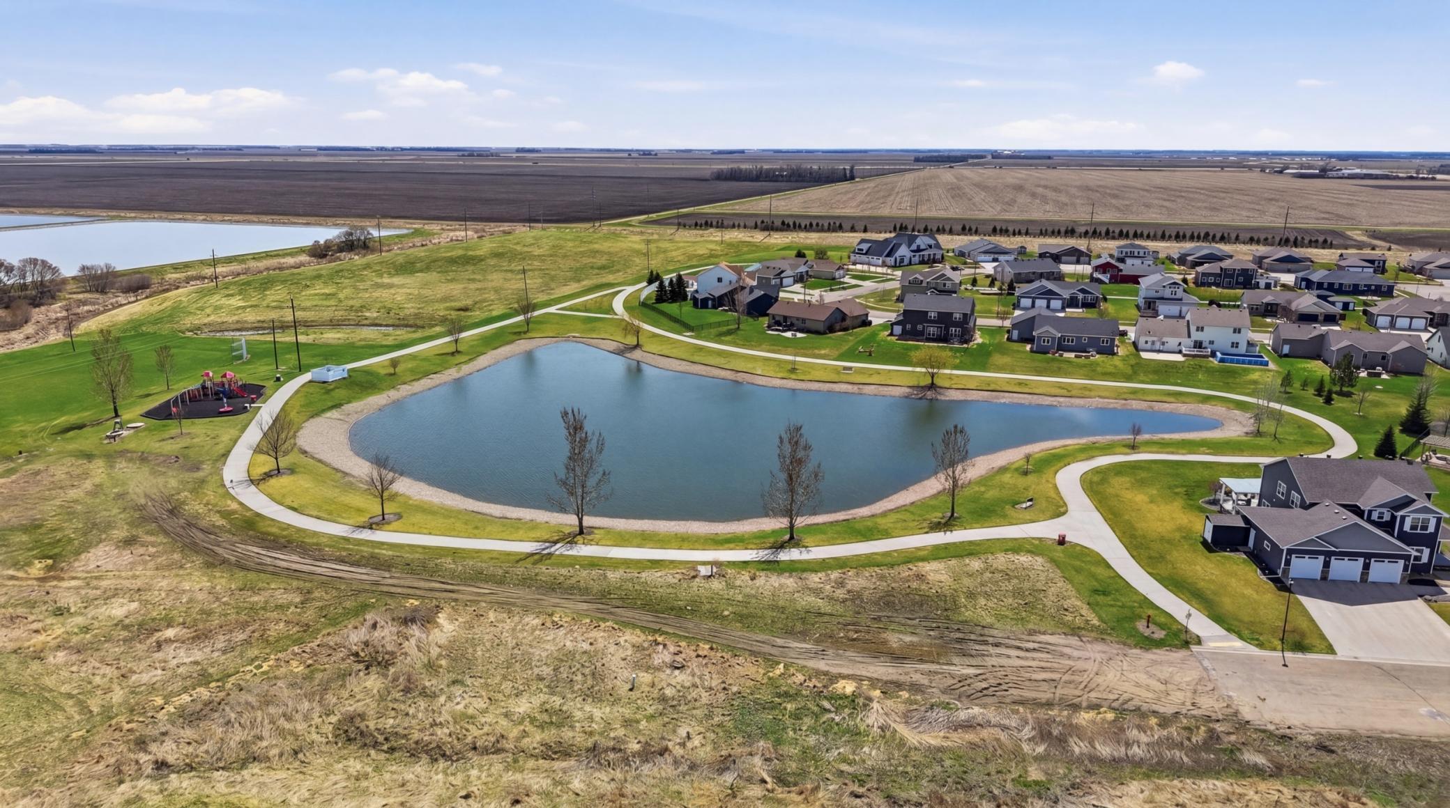 nearby pond with paths & playground