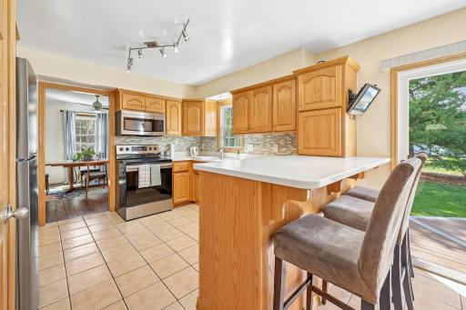 Kitchen has plenty of countertop space for food preparation and also bar seating!