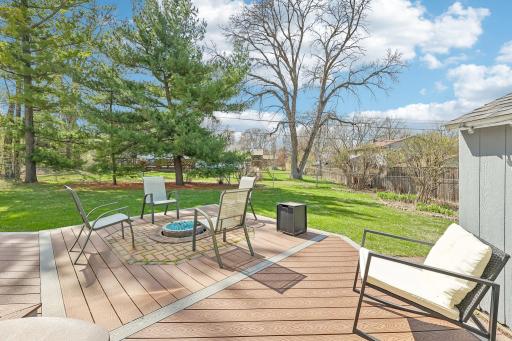 Nice deck overlooking the flat, fully fenced backyard