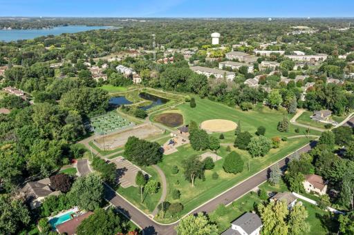arial view of Medley Park! Playground, walking paths, softball field, basketball court, and raised garden bed community garden
