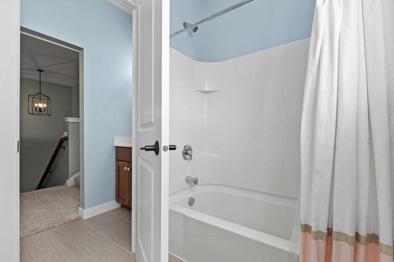 Upper Level bathroom with tub