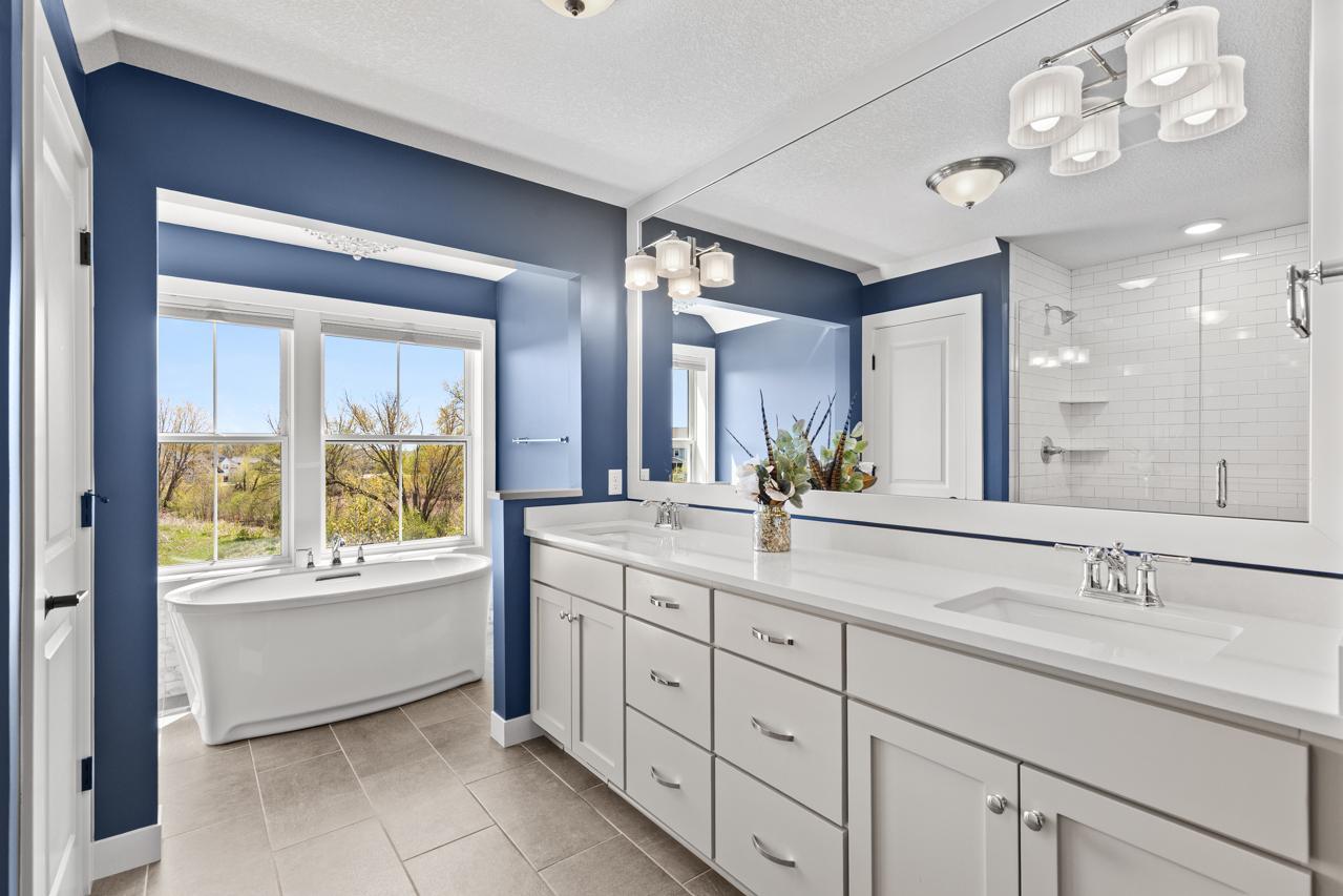 Primary bathroom with a grand soaking tub and a large shower.