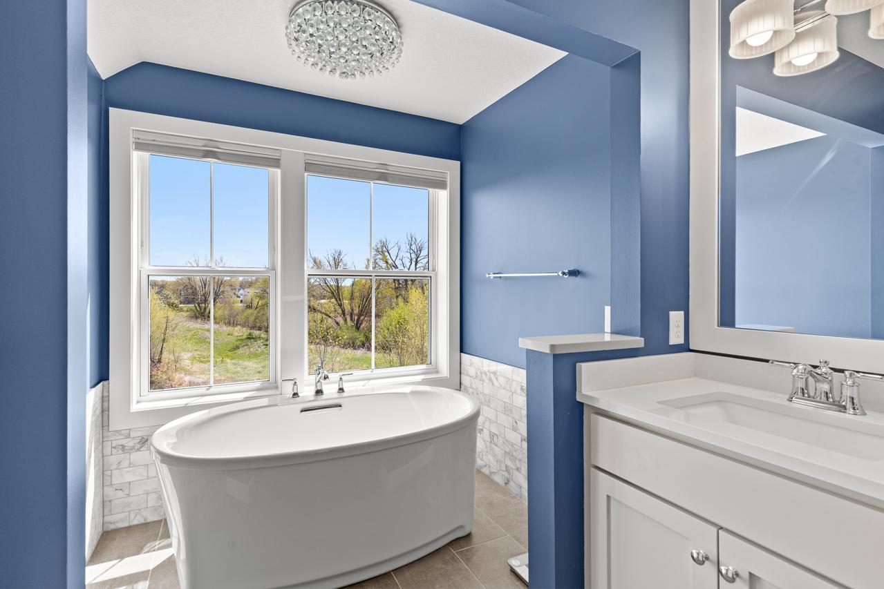 Large soaking tub in primary bath.
