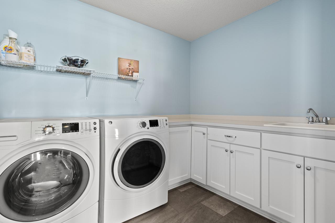 Spacious laundry room with sink - upper level