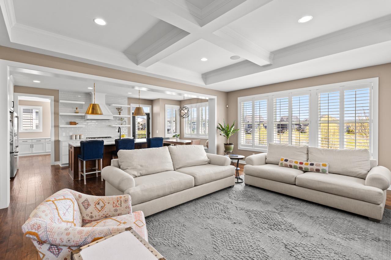 Family room connects to the kitchen and has lots of windows looking out to the pond and open area.