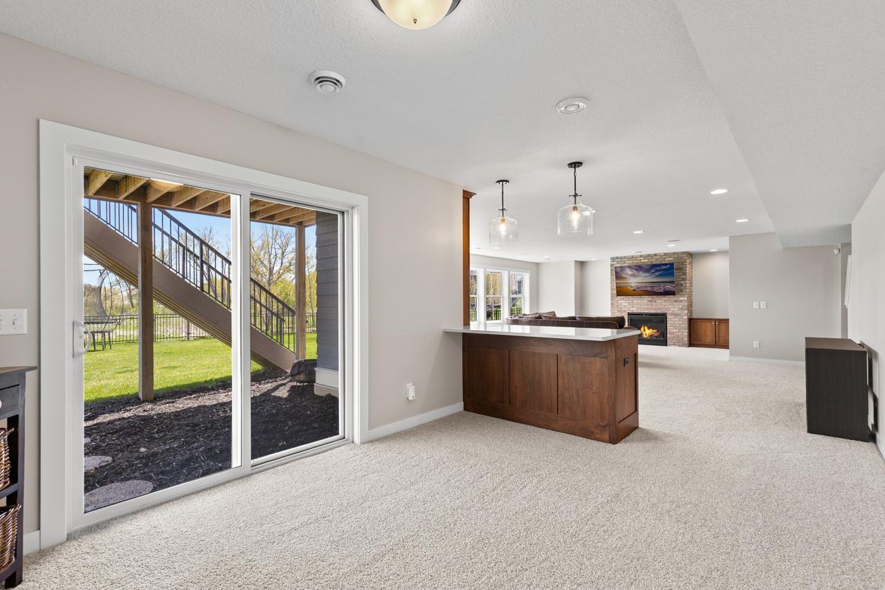 Walk-out lower level. Custom bar.
