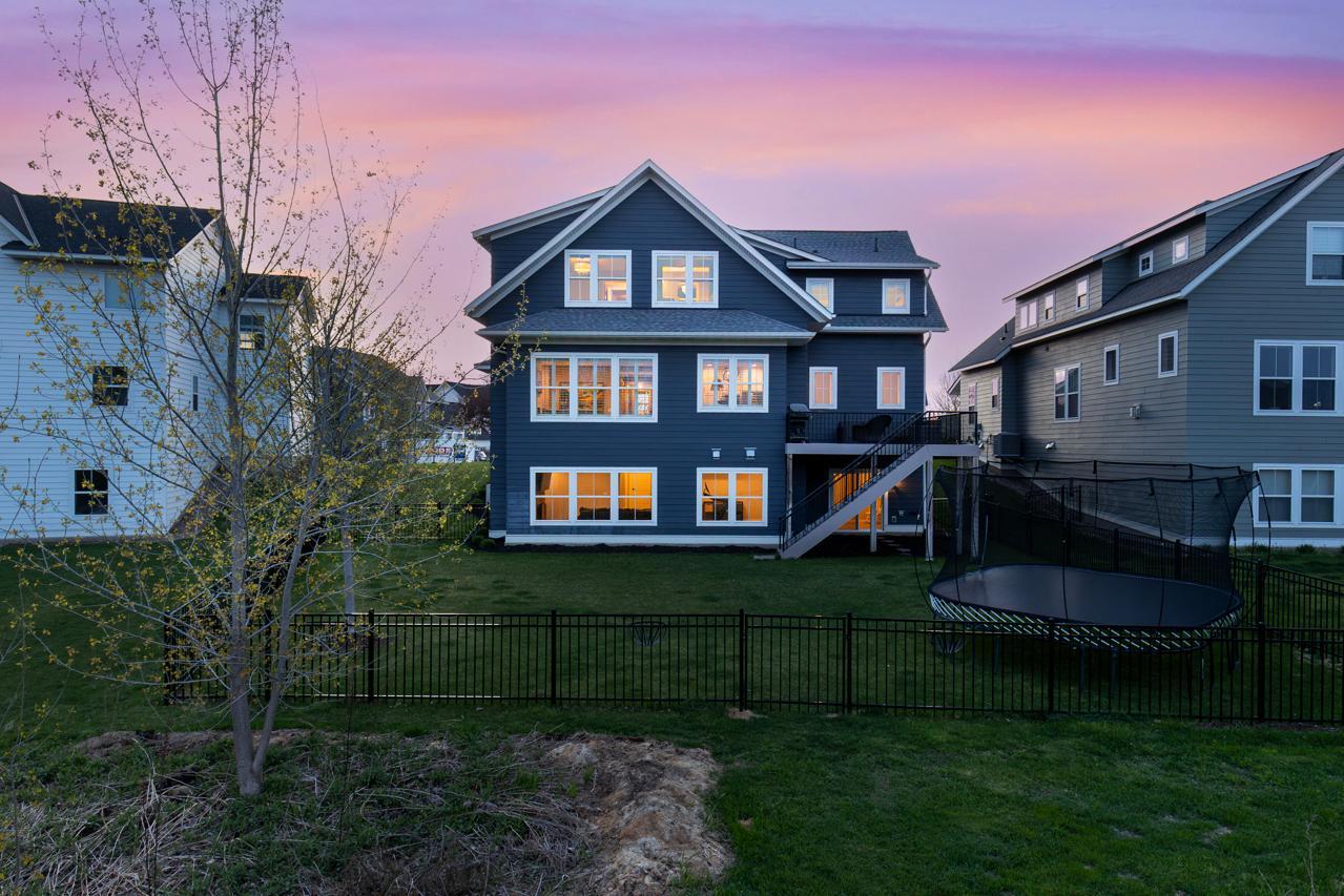 Newly fenced-in backyard with plenty of room for recreation.