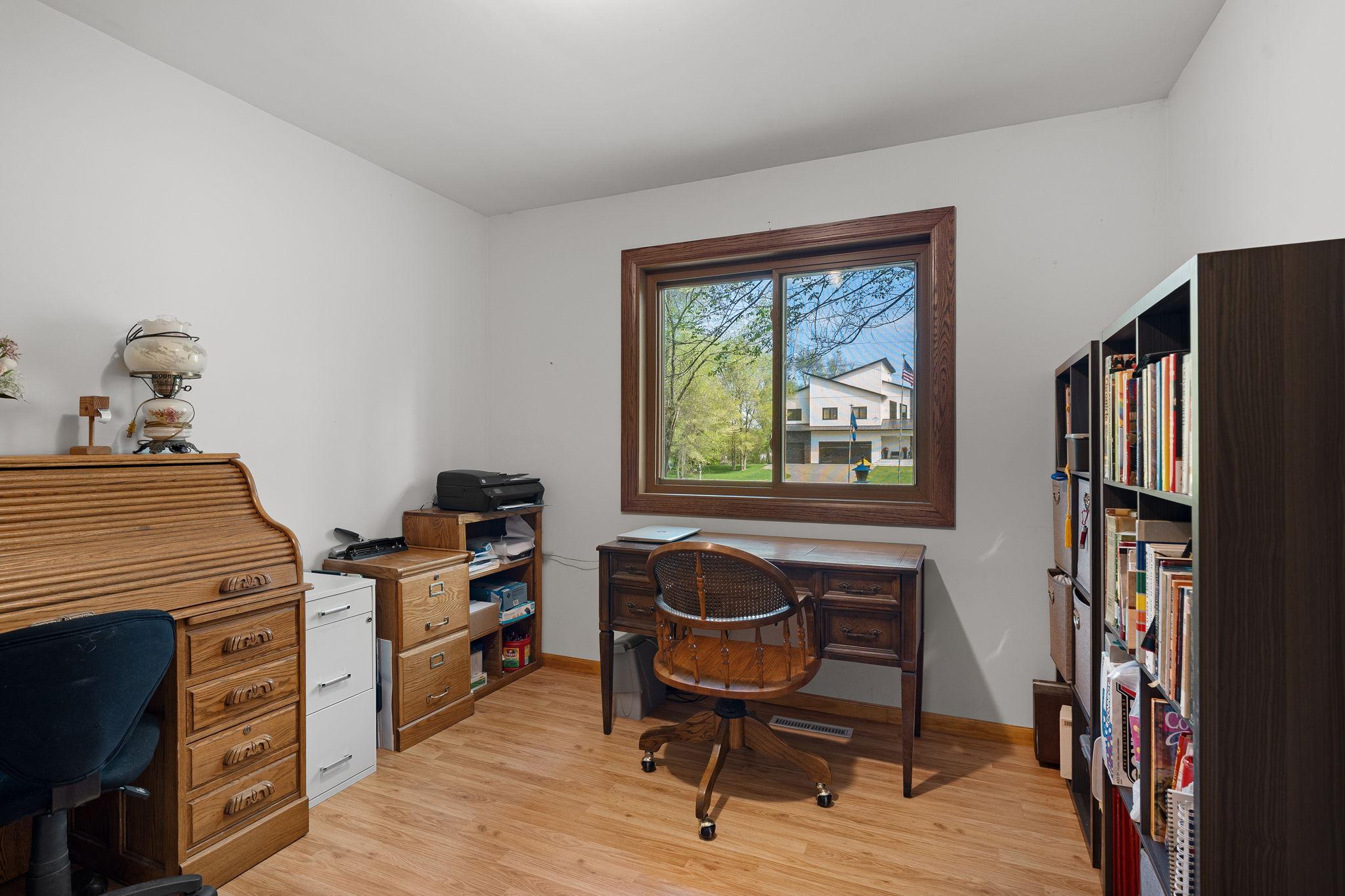 Main Floor Bedroom is currently set up as an additional office