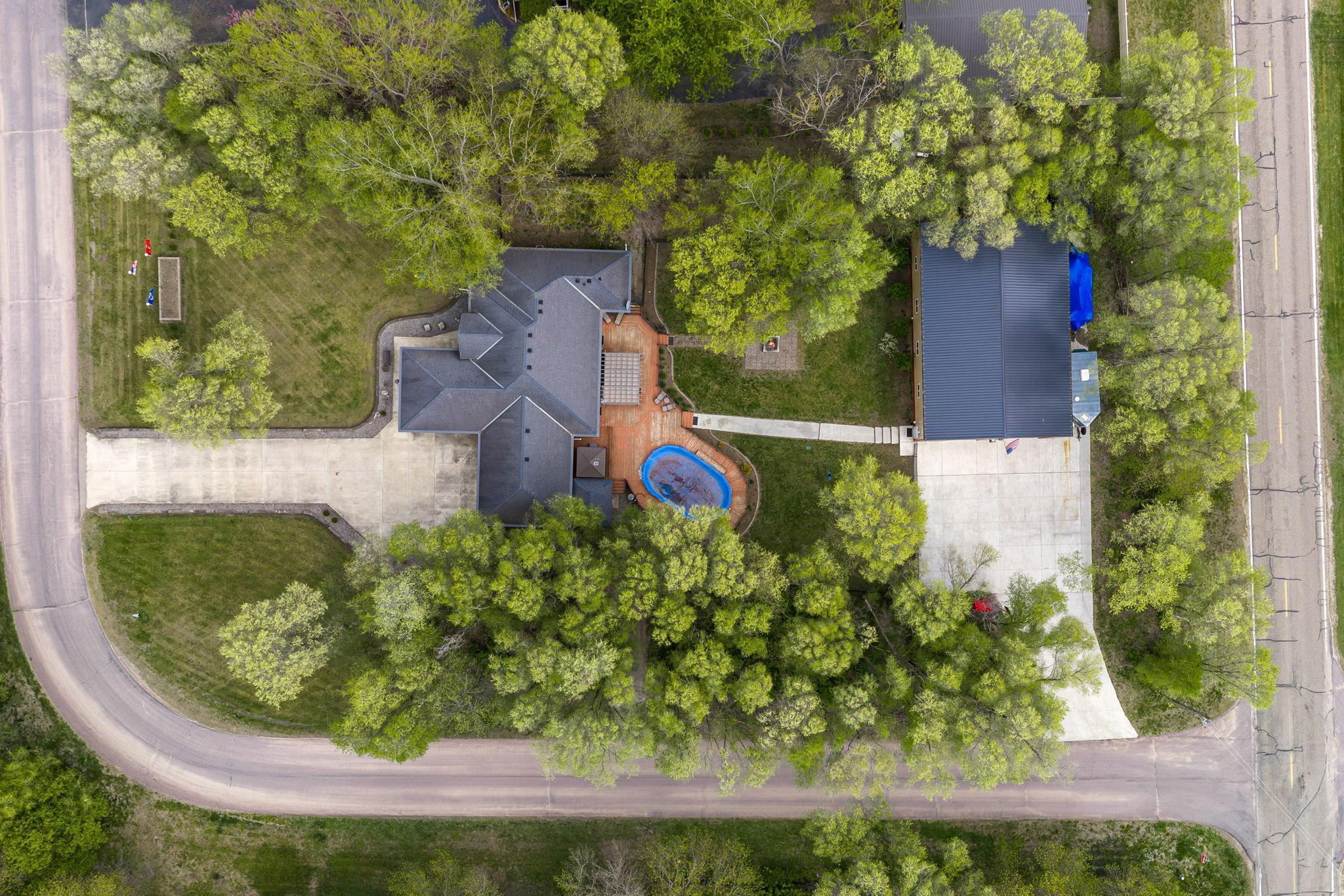 Pool and Hot Tub is Private. Shop has a 6' thick cement pad next to it for additional parking
