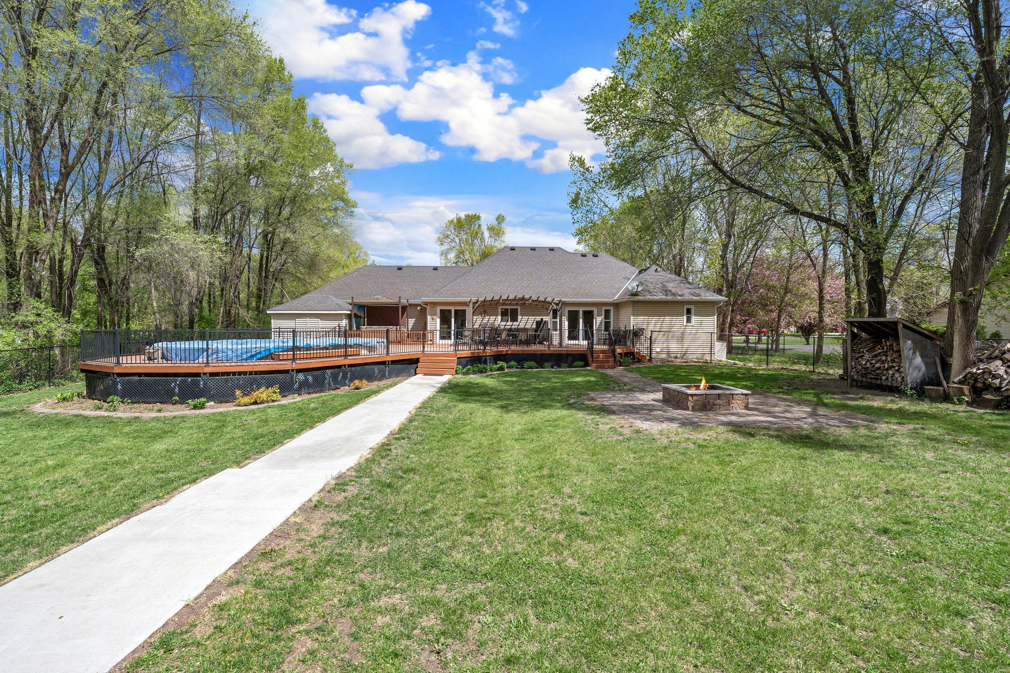 Fenced Back Yard with Hot Tub, Pool, Fire Pit, and a Separate Fenced Dog Run. Yard also has new irrigation system.
