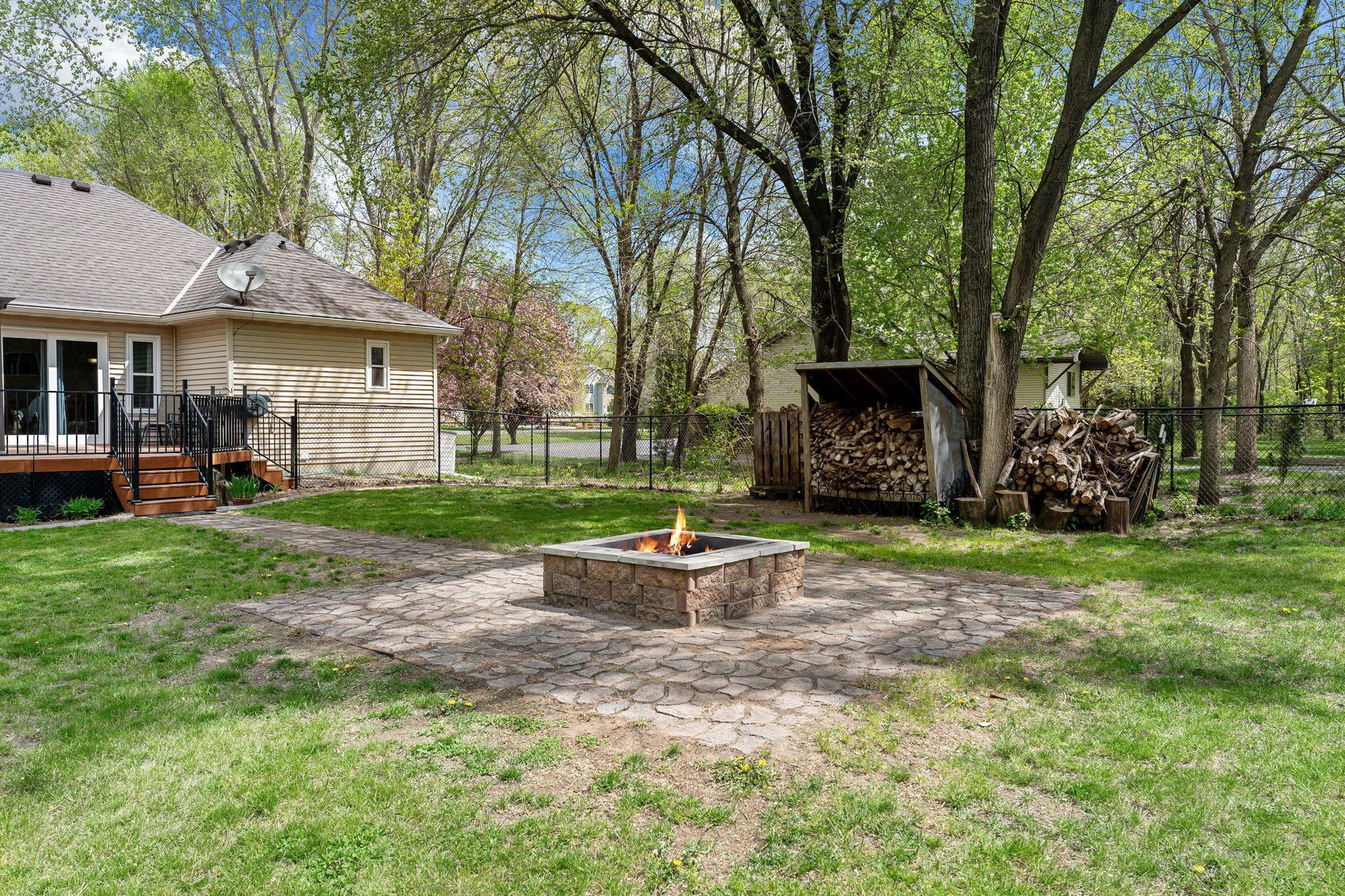 Fire Pit with an abundance of firewood