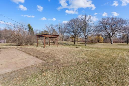 Backyard with pergola backs to the park.