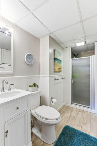 A 3/4 bath in the lower level with ceramic floors and linen storage.