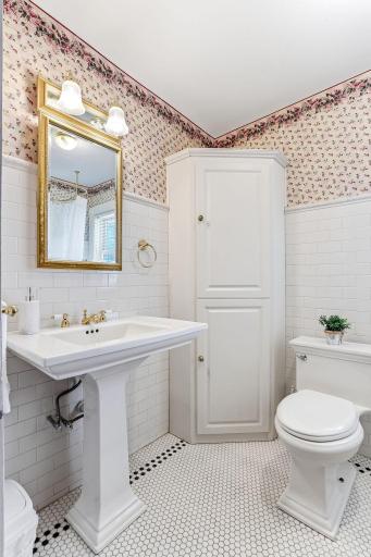 The primary bath includes a claw-foot tub and ceramic walls and floors.