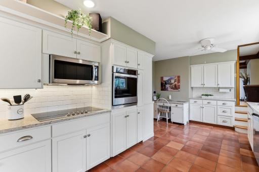Counter top range, wall oven and microwave.