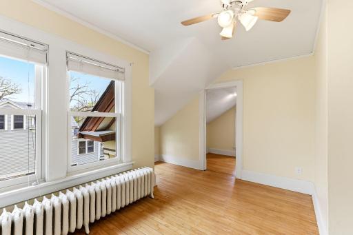 This bedroom has an adjoining room to be used as a study or even an extra large closet.