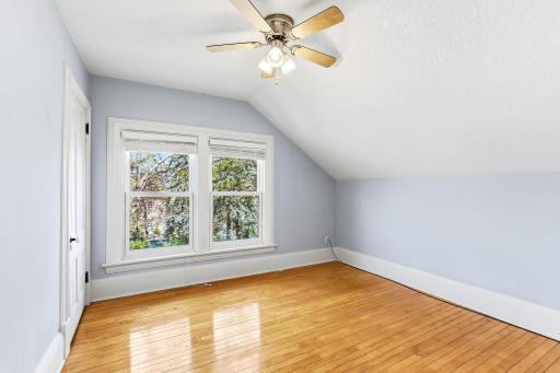 Bedroom 3, hardwood floors, closet and a walkthru to the 4th bedroom.