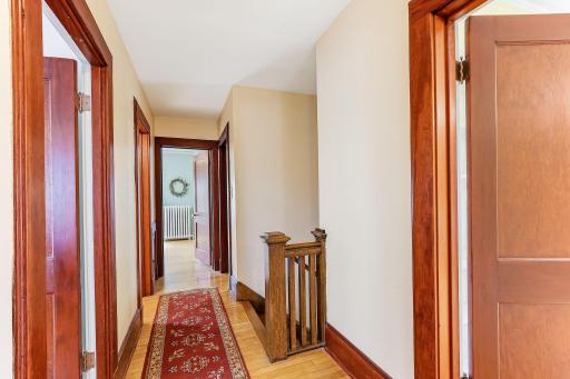 The upper hallway and mission style railing.