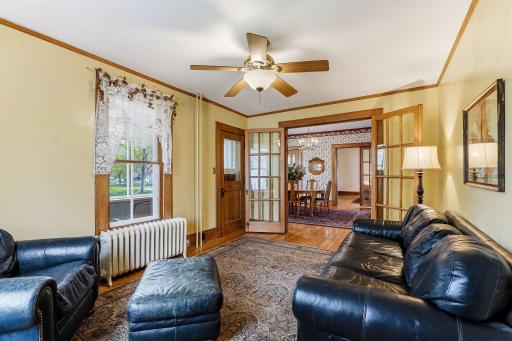 Family room, parlor,office? The door ldads to another porch.