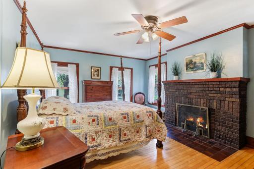 The primary bedroom on the upper level has it's own fireplace.