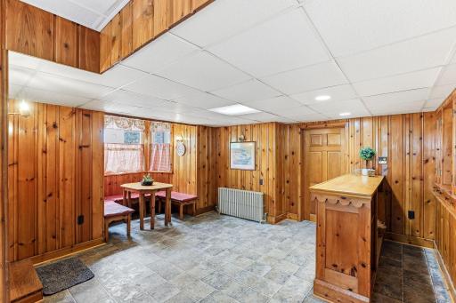 The lower level offers this dining area, a bar for entertaining and hard-surface flooring.