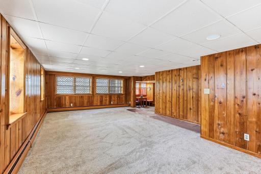 Look out windows, wood panel walls and carpet keep this room feeling comfortable all year long.