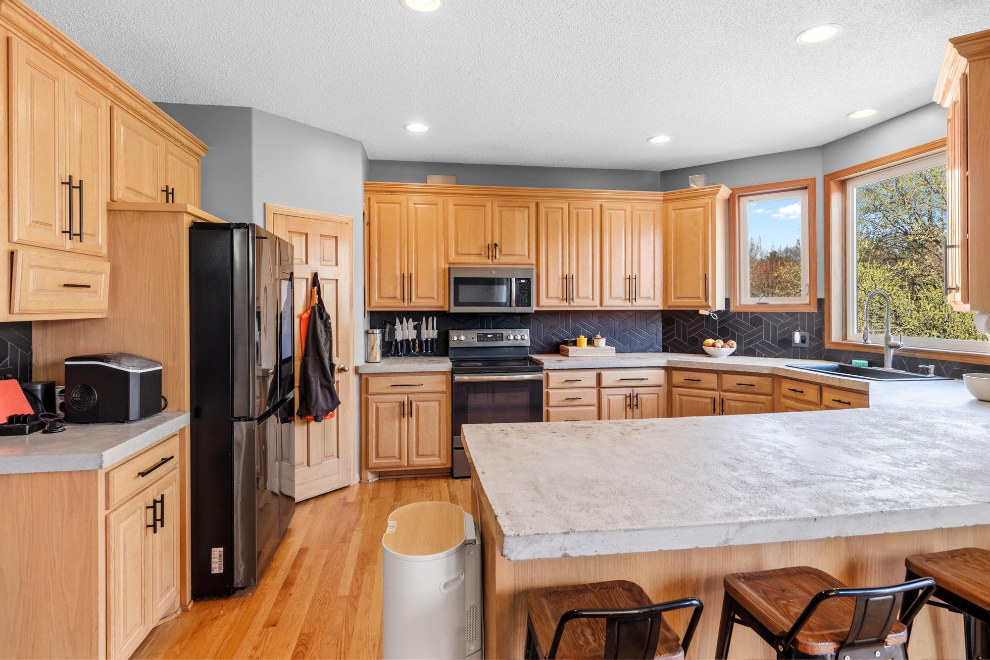 Great additional seating at the breakfast counter. There's wonderful storage in the Pantry. The Kitchen offers an abundance of cabinet and counter space.