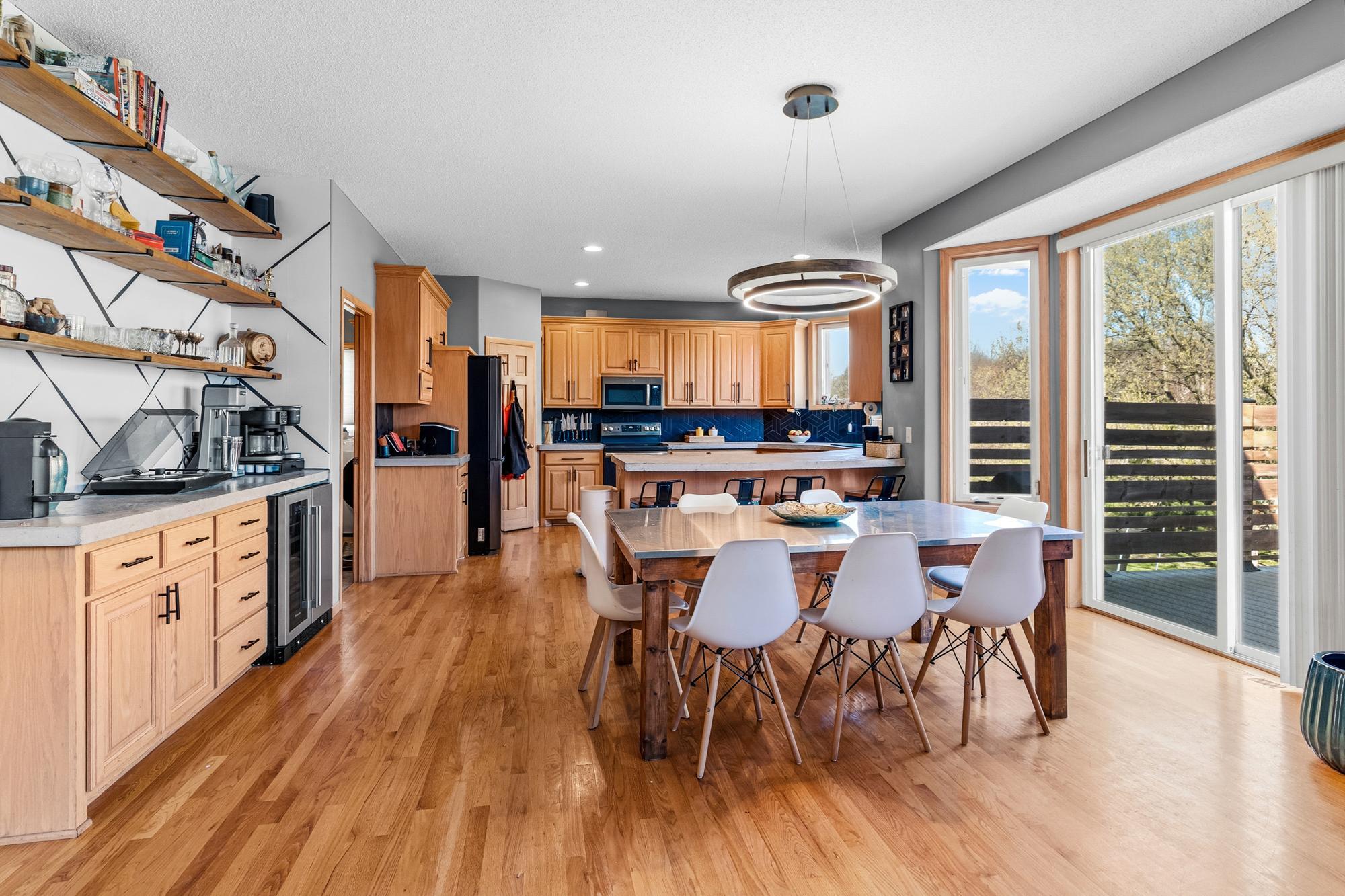 The Dining Room offers ample space to share meals. Step out on the spacious deck.